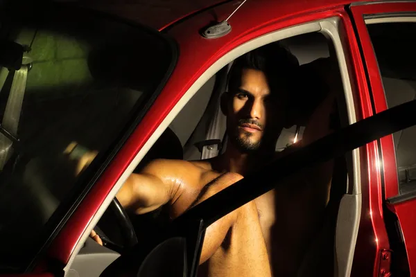 Hunk in car — Stock Photo, Image