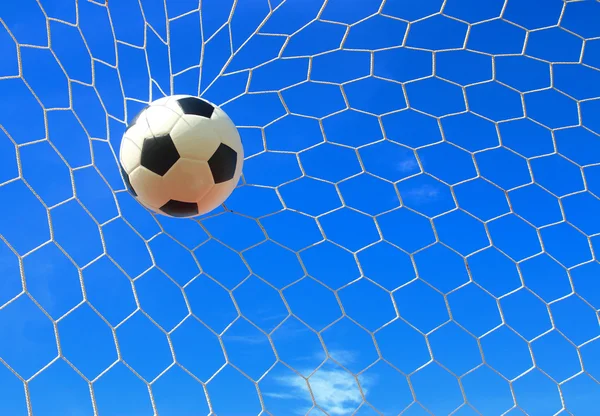 Soccer ball in goal net — Stock Photo, Image