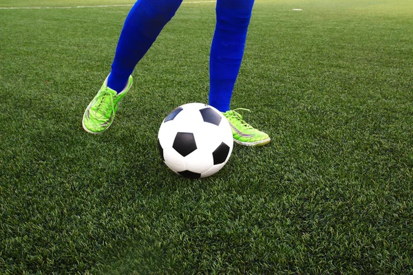Foot kicking soccer ball — Stock Photo, Image