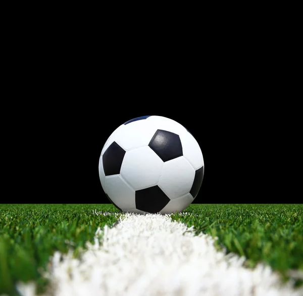 Soccer ball on the green field — Stock Photo, Image