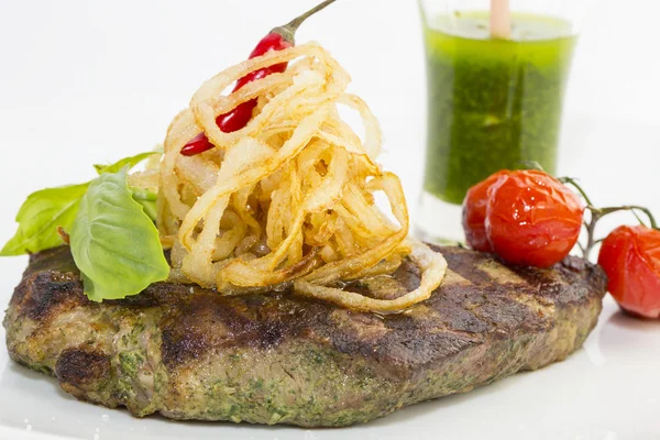 Grilled steak with sauce and greens — Stock Photo, Image