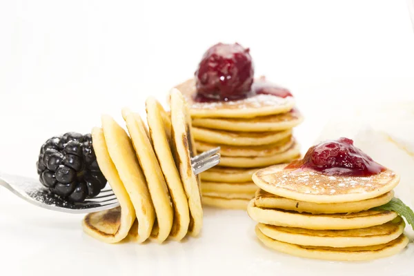 Pancakes with berries and jam — Stock Photo, Image