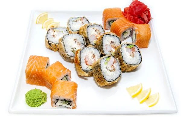 Japanese rolls with fish and vegetables — Stock Photo, Image