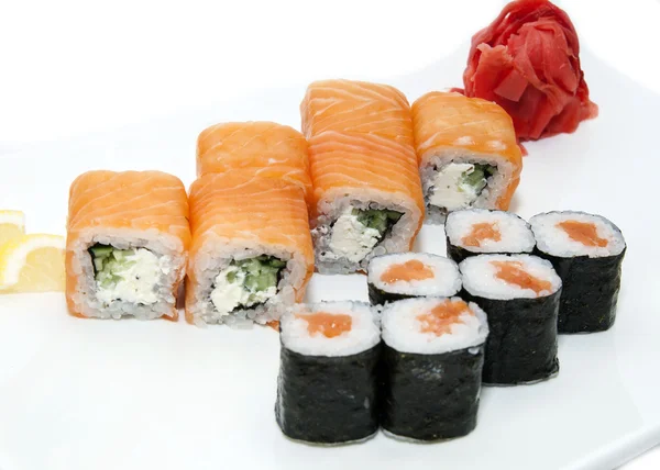 Japanese rolls with fish and vegetables — Stock Photo, Image