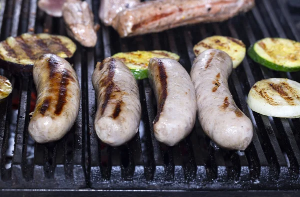 Cooking sausages on the grill — Stock Photo, Image