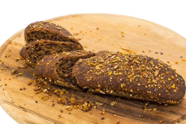 Bread on the wooden plate — Stock Photo, Image