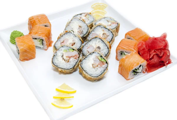 Japanese rolls with fish and vegetables — Stock Photo, Image