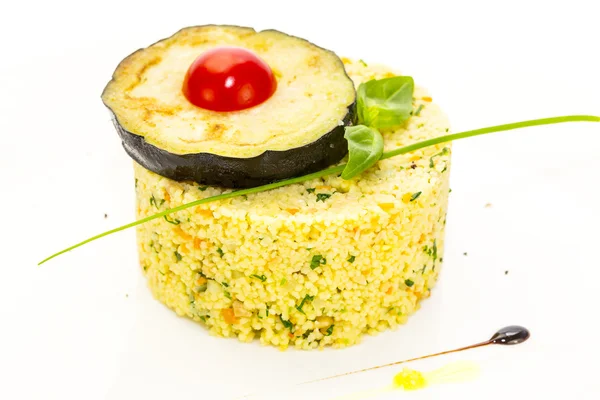 Couscous embellished with eggplant and tomato — Stock Photo, Image
