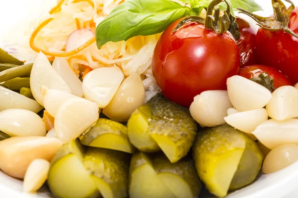 Pickled vegetables, cucumber tomatoes asparagus and garlic cabbage — Stock Photo, Image