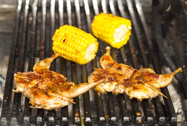 Grilling poultry quails in a restaurant — Stock Photo, Image