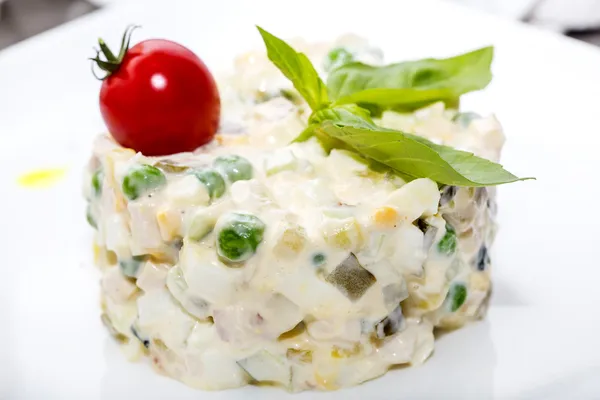 Salad with meat on a table in a restaurant — Stock Photo, Image