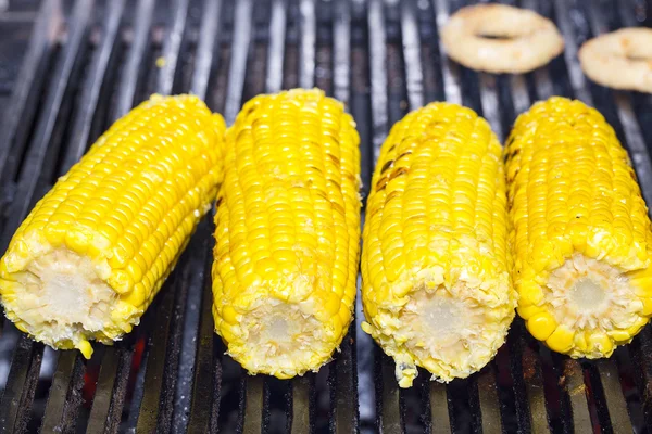 Cooking corn on the grill in the restaurant — Stock Photo, Image