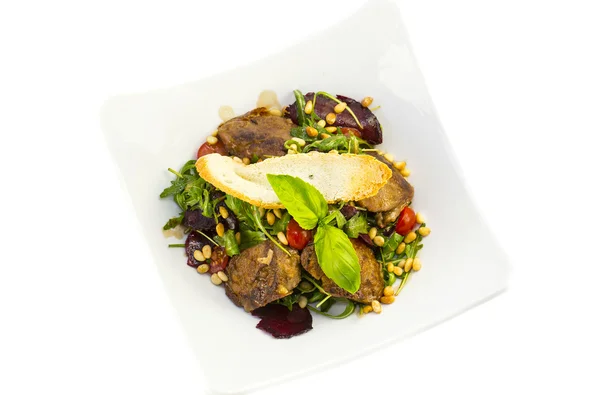 Rabbit liver salad with arugula in a restaurant — Stock Photo, Image