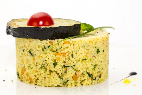 Couscous embellished with eggplant and tomato — Stock Photo, Image