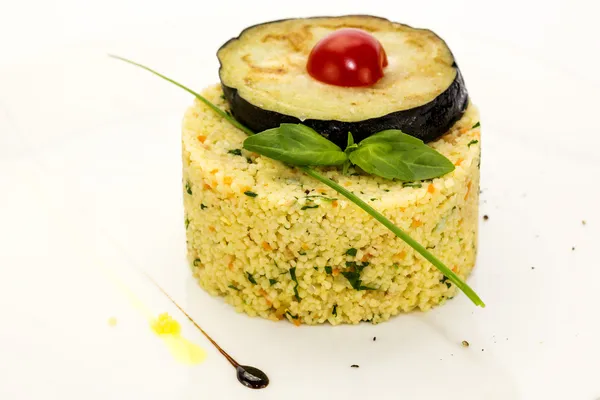 Couscous embellished with eggplant and tomato — Stock Photo, Image