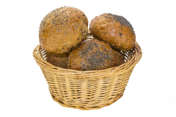 Baking in a wicker bread bins on white background — Stock Photo, Image