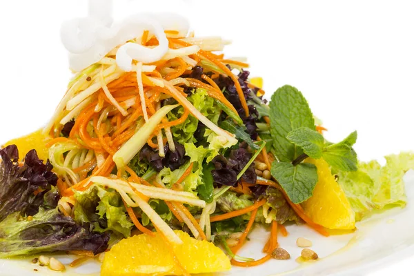 Salad of fruit and vegetables on a white background in the restaurant — Stock Photo, Image