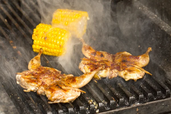 Grilling poultry quails in a restaurant — Stock Photo, Image