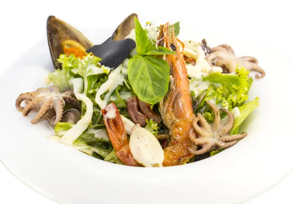 Salad with vegetables and seafood on the table in a restaurant — Stock Photo, Image