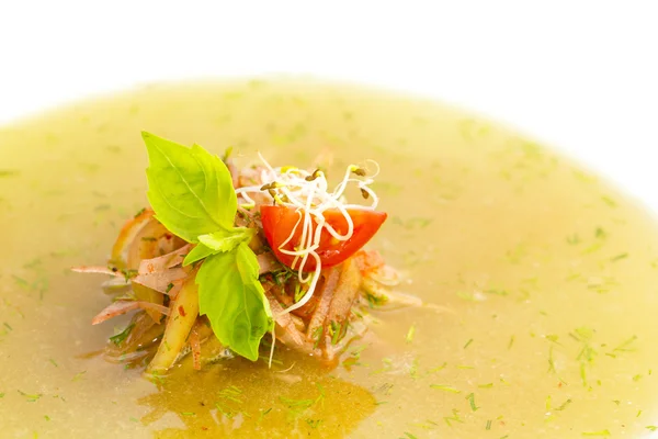 Cucumber soup decorated with fresh herbs and tomatoes in a restaurant — Stock Photo, Image