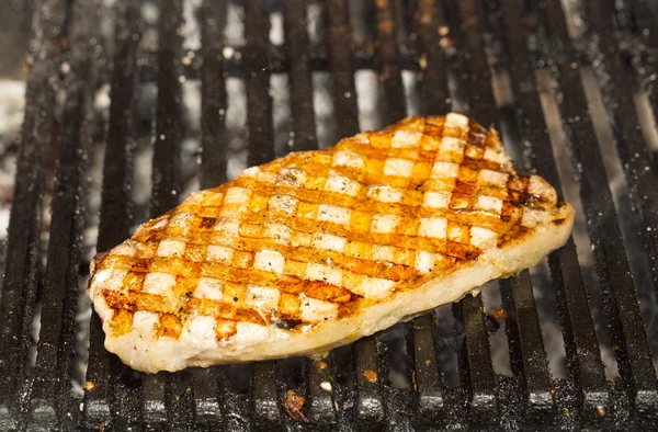 Catfish steak cooking on the grill — Stock Photo, Image