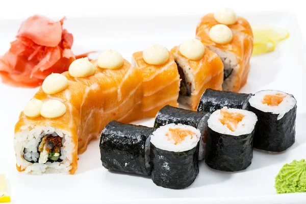 Japanese rolls with fish and vegetables — Stock Photo, Image
