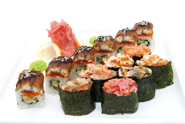 Japanese rolls with fish and vegetables — Stock Photo, Image