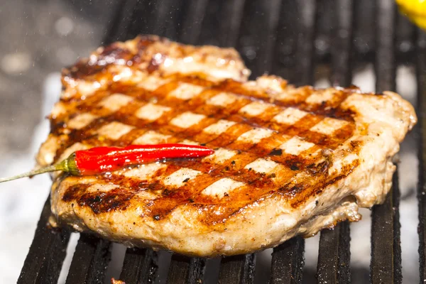 Beef steak cooking on the grill — Stock Photo, Image