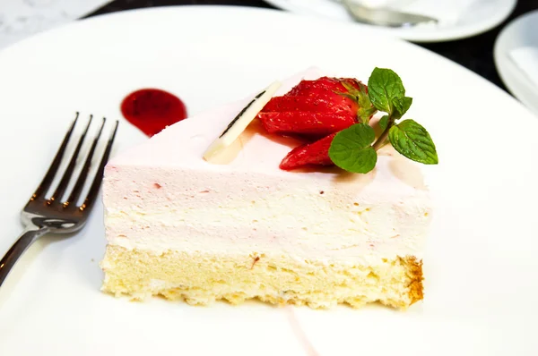 Piece of cream cake with strawberry and mint — Stock Photo, Image