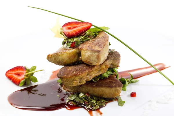Roast goose liver is decorated with greens and strawberries — Stock Photo, Image