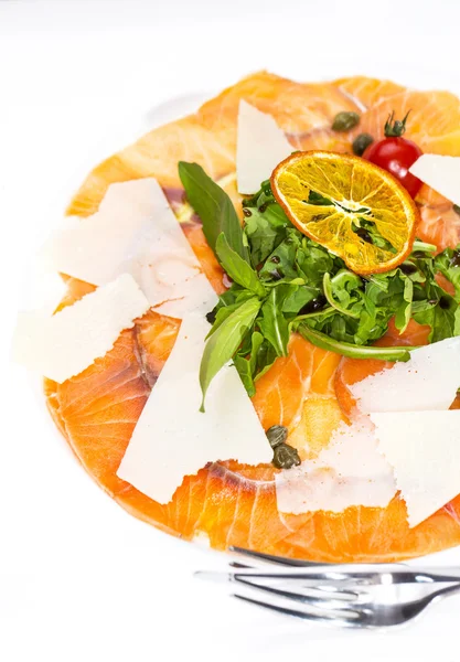 Carpaccio of salmon on a table in a restaurant — Stock Photo, Image