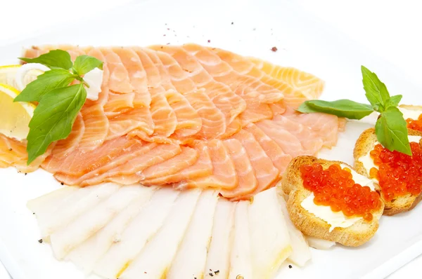 Sandwiches with caviar and sliced fish — Stock Photo, Image