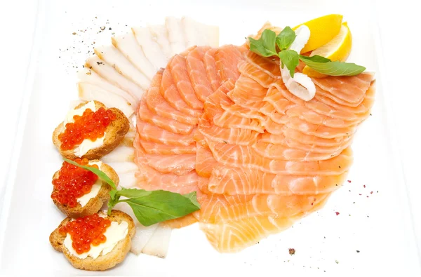 Sandwiches with caviar and sliced fish — Stock Photo, Image