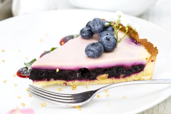 Piece of blueberry pie on a table in a restaurant — Stock Photo, Image