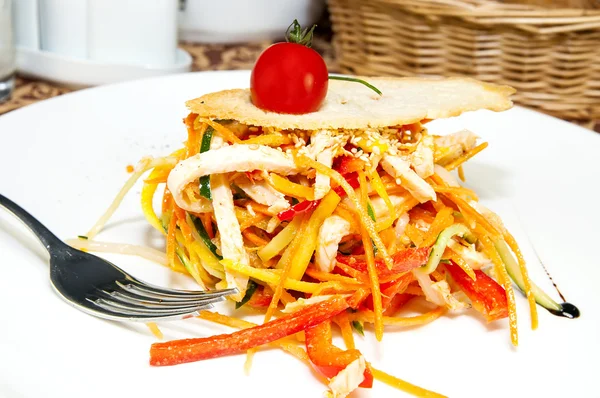Salad of steamed vegetables on a white plate in a restaurant — Stock Photo, Image