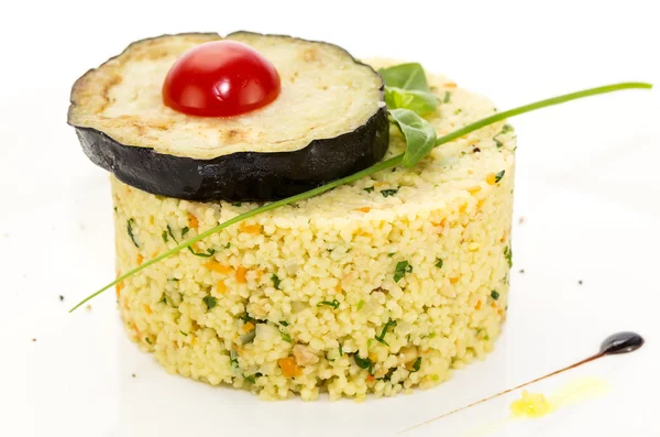 Couscous urashen tomato and aubergine on a white plate — Stock Photo, Image