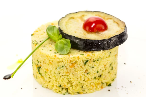 Couscous embellished with eggplant and tomato — Stock Photo, Image