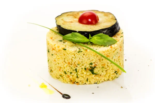 Couscous embellished with eggplant and tomato — Stock Photo, Image