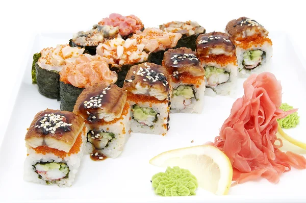 Japanese rolls in a restaurant with fish and vegetables — Stock Photo, Image