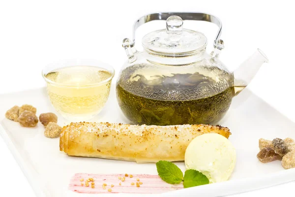 Strudel with ice cream and tea — Stock Photo, Image