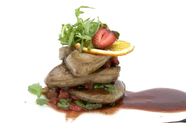 Roast goose liver is decorated with greens and strawberries — Stock Photo, Image