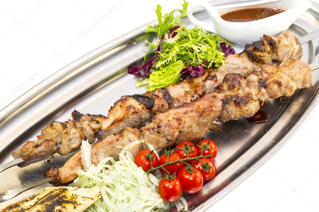 Kebab meat sauce and salad vegetables