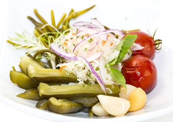 Pickled vegetables, cucumber tomatoes asparagus and garlic cabbage — Stock Photo, Image