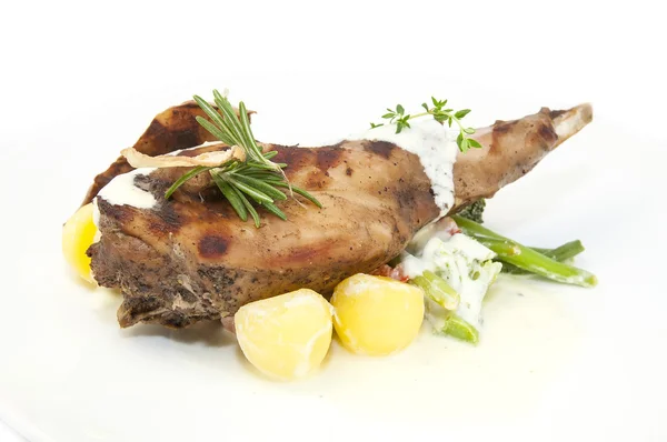 Roasted rabbit meat and potatoes with vegetables — Stock Photo, Image