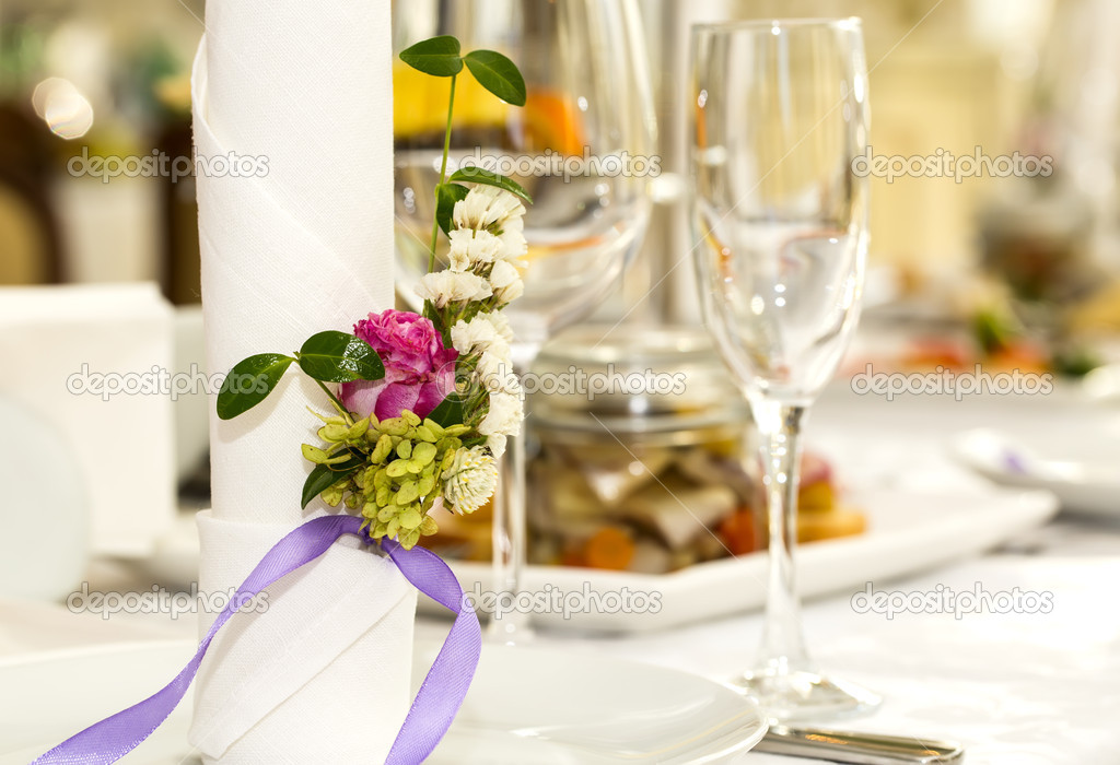 Table ware glass glasses and fresh flowers