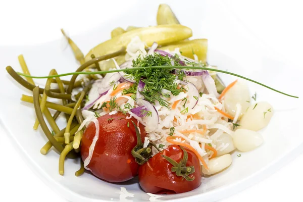 Pickled vegetables, cucumber tomatoes asparagus and garlic cabbage — Stock Photo, Image