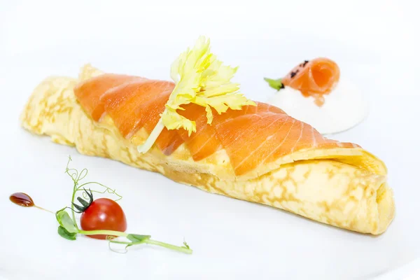 Scrambled eggs with cheese and salmon decorated with tomato — Stock Photo, Image