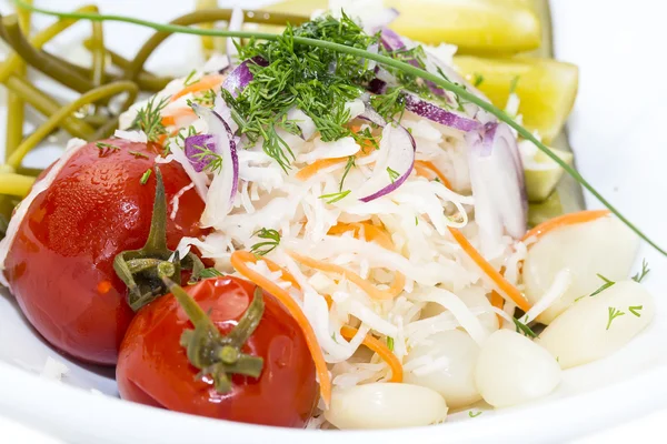 Pickled vegetables, cucumber tomatoes asparagus and garlic cabbage — Stock Photo, Image