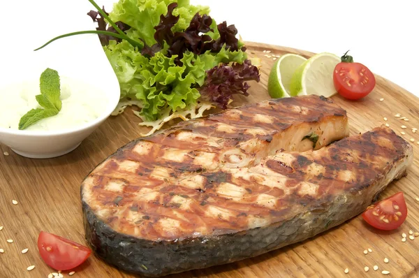 Grilled salmon on a plate with greens — Stock Photo, Image