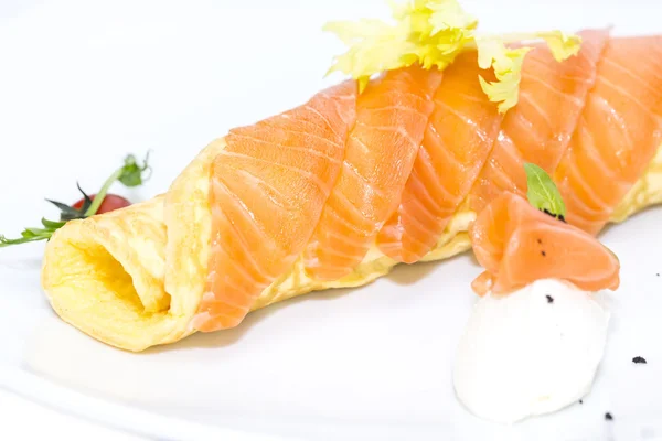 Scrambled eggs with cheese and salmon decorated with tomato — Stock Photo, Image